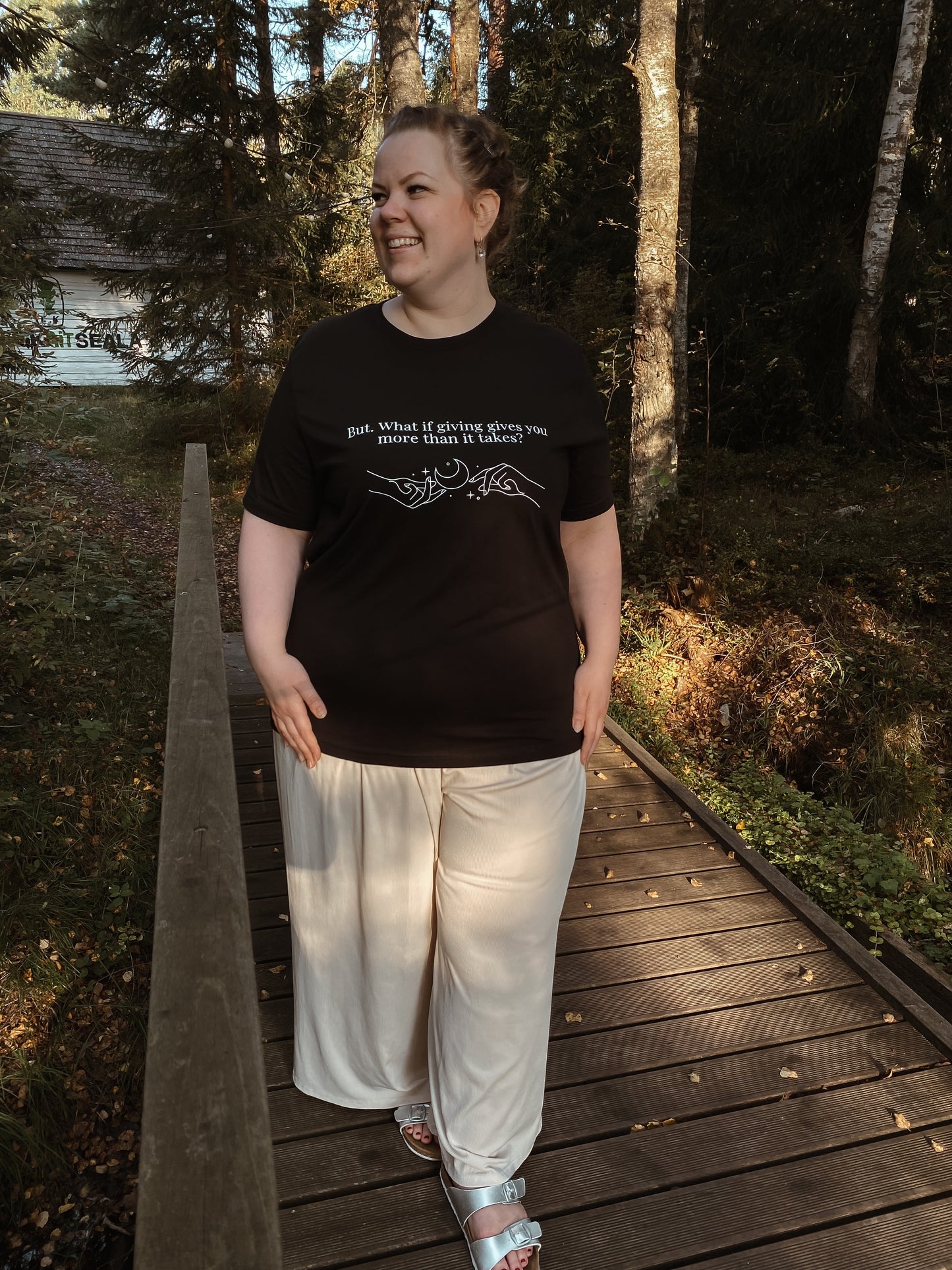 “But. What if giving gives you more than it takes?” Unisex Black T-Shirt