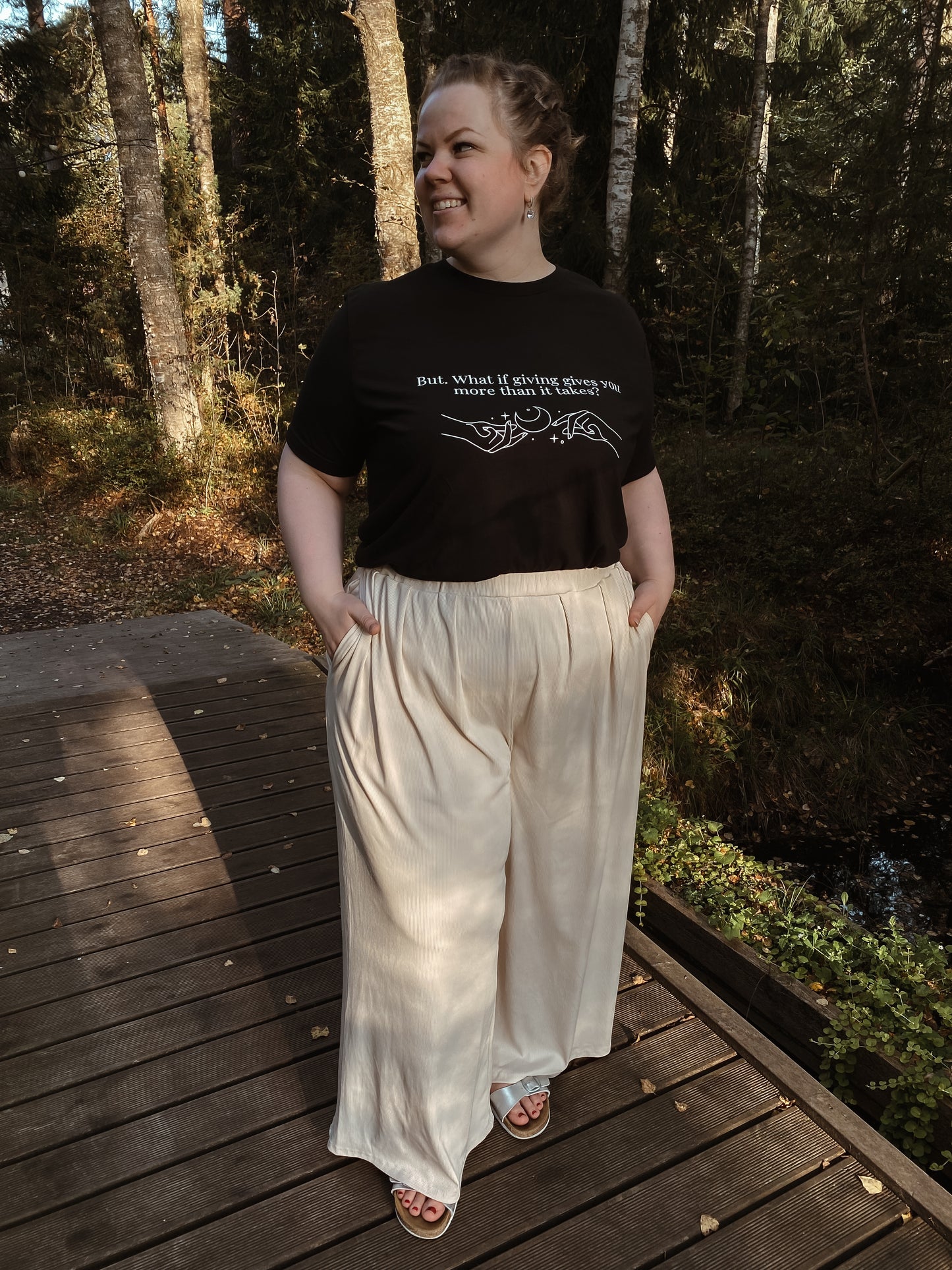“But. What if giving gives you more than it takes?” Unisex Black T-Shirt