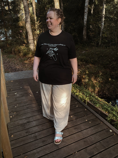 “But Who Are You When Nobody Is Watching?” Unisex Black T-Shirt