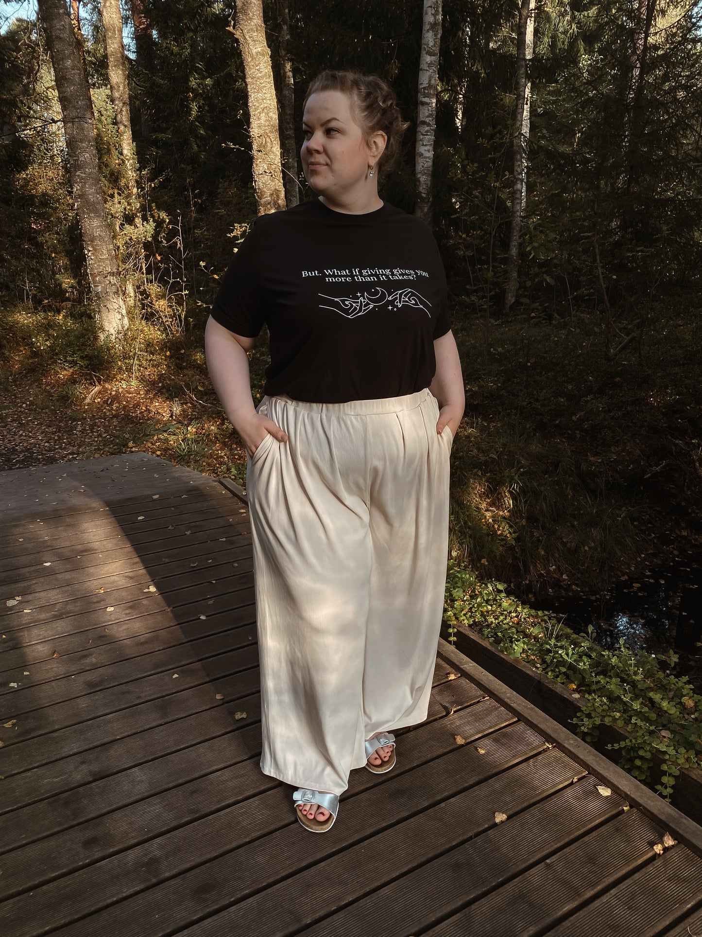 “But. What if giving gives you more than it takes?” Unisex Black T-Shirt